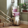 Sarum stairlift for curved stairs in purple